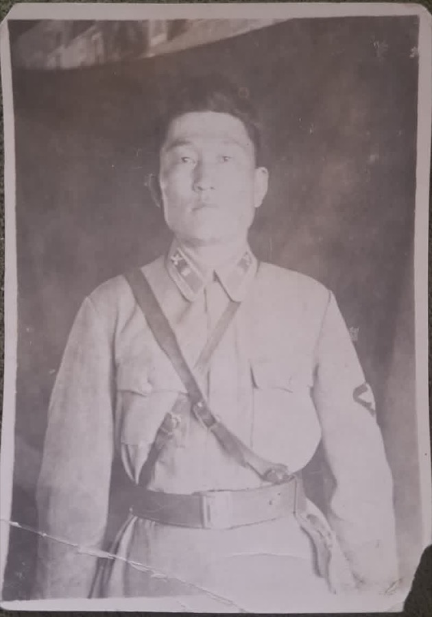 Original faded sepia portrait of a man in uniform